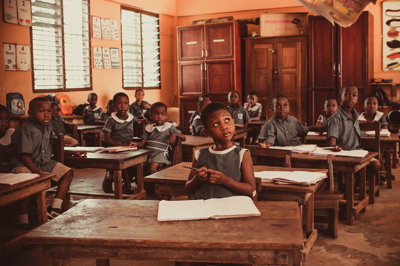 African children attentively participating in a classroom lesson, fostering education and learning.