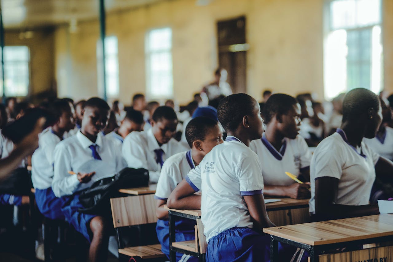 hero-img-01 Students attentively engaged in a classroom setting, focusing on their studies.